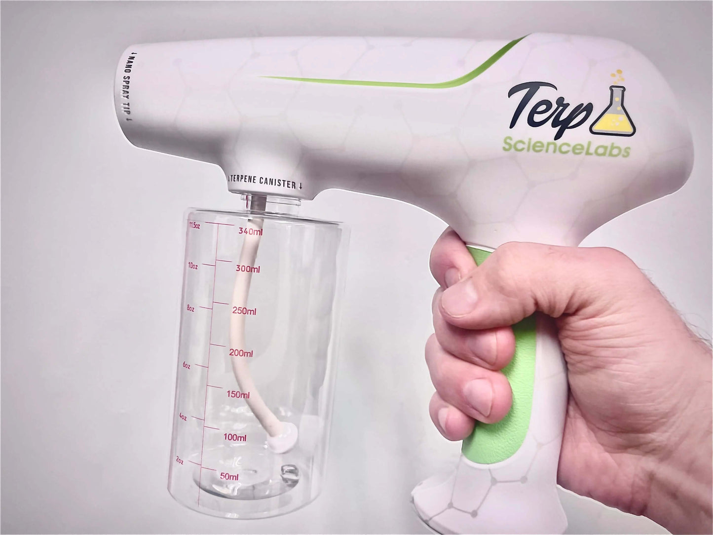 Hand holding Terpene Gun Sprayer by Terp Science Labs featuring nano technology for aroma infusion