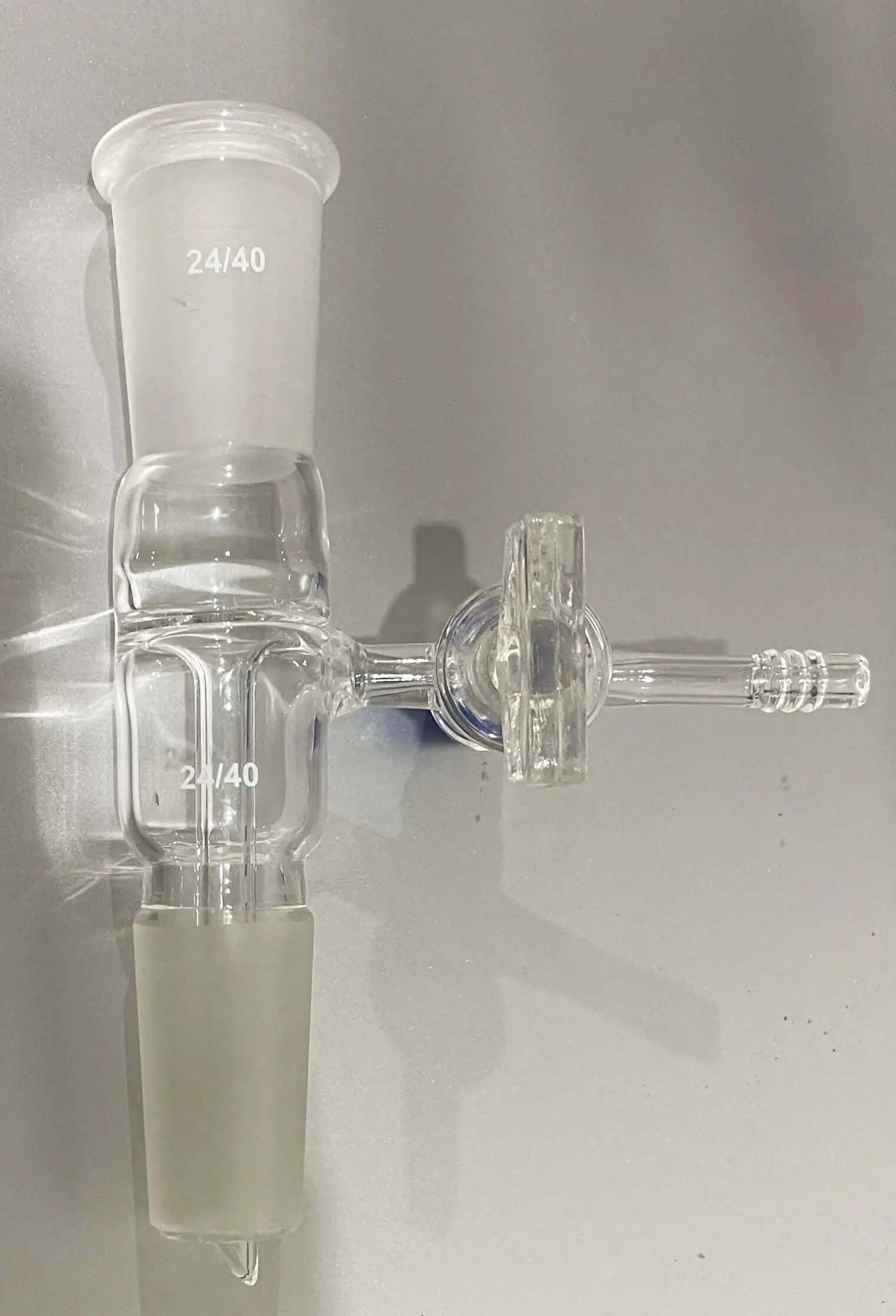 Vacuum Take-off Adapter with Side PTFE Stopcock, borosilicate glass, 24/40 joints and drip tip, with 10mm serrated hose connection