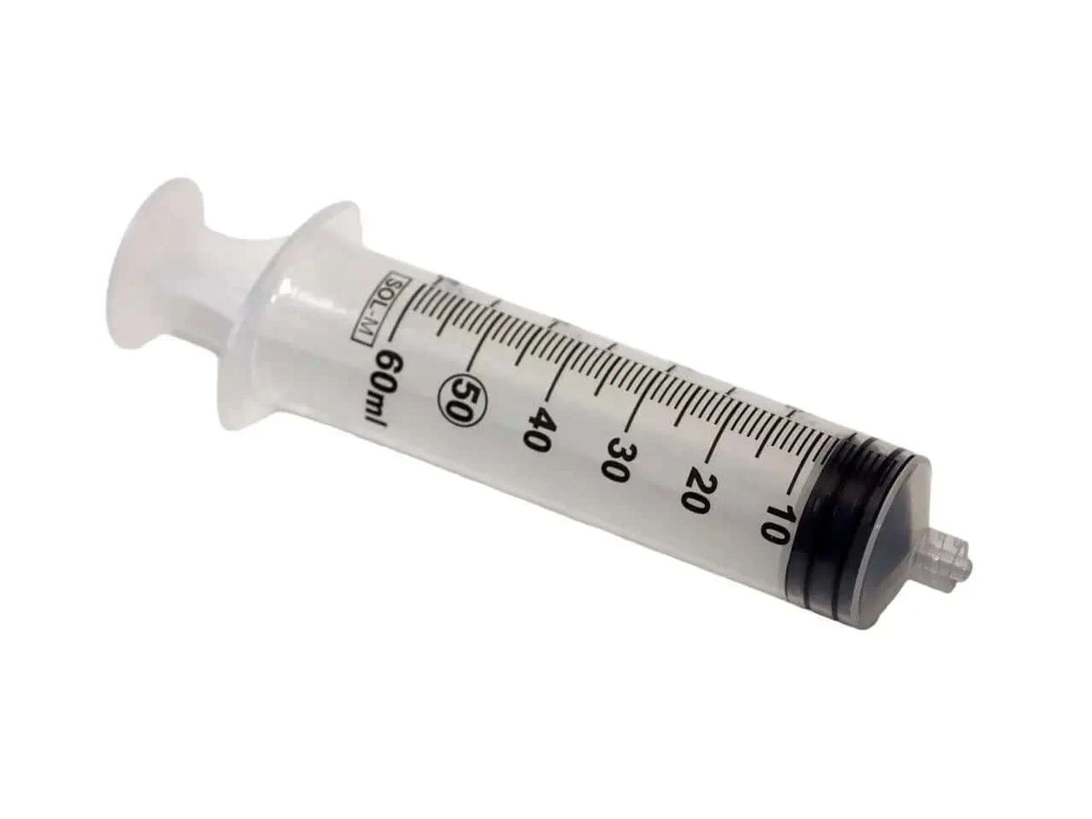 Syringe with graduated barrel for compatible technical dispensing