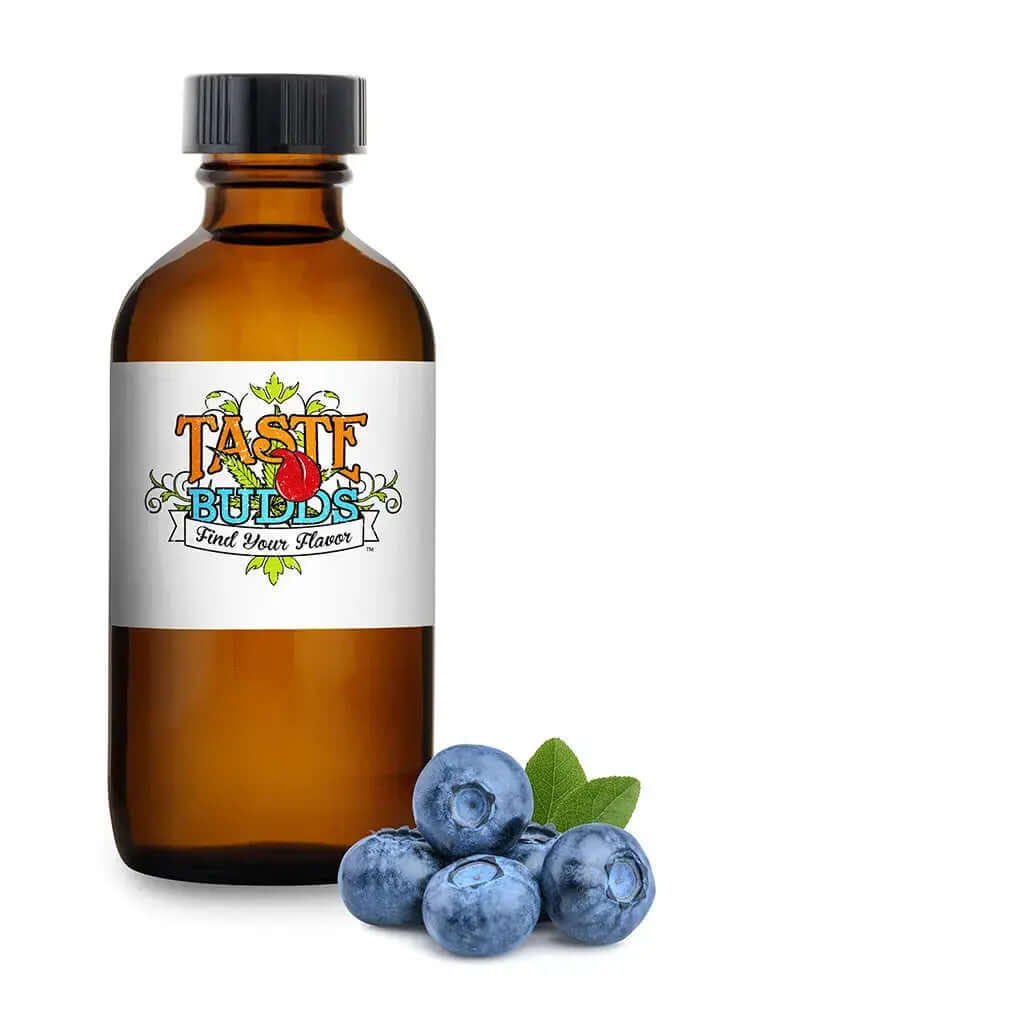 Taste Budds MCT Blend Terpenes bottle next to fresh blueberries, showcasing premium flavor fusion.