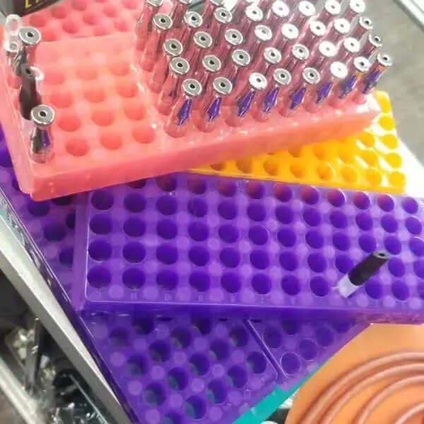 color coded filling stations with cartridges organized on colorful trays