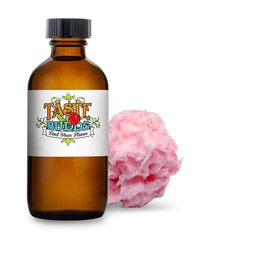 Cotton Candy Pink terpenes 10 mL MCT Blend bottle next to pink cotton candy, offering a nostalgic carnival flavor experience.