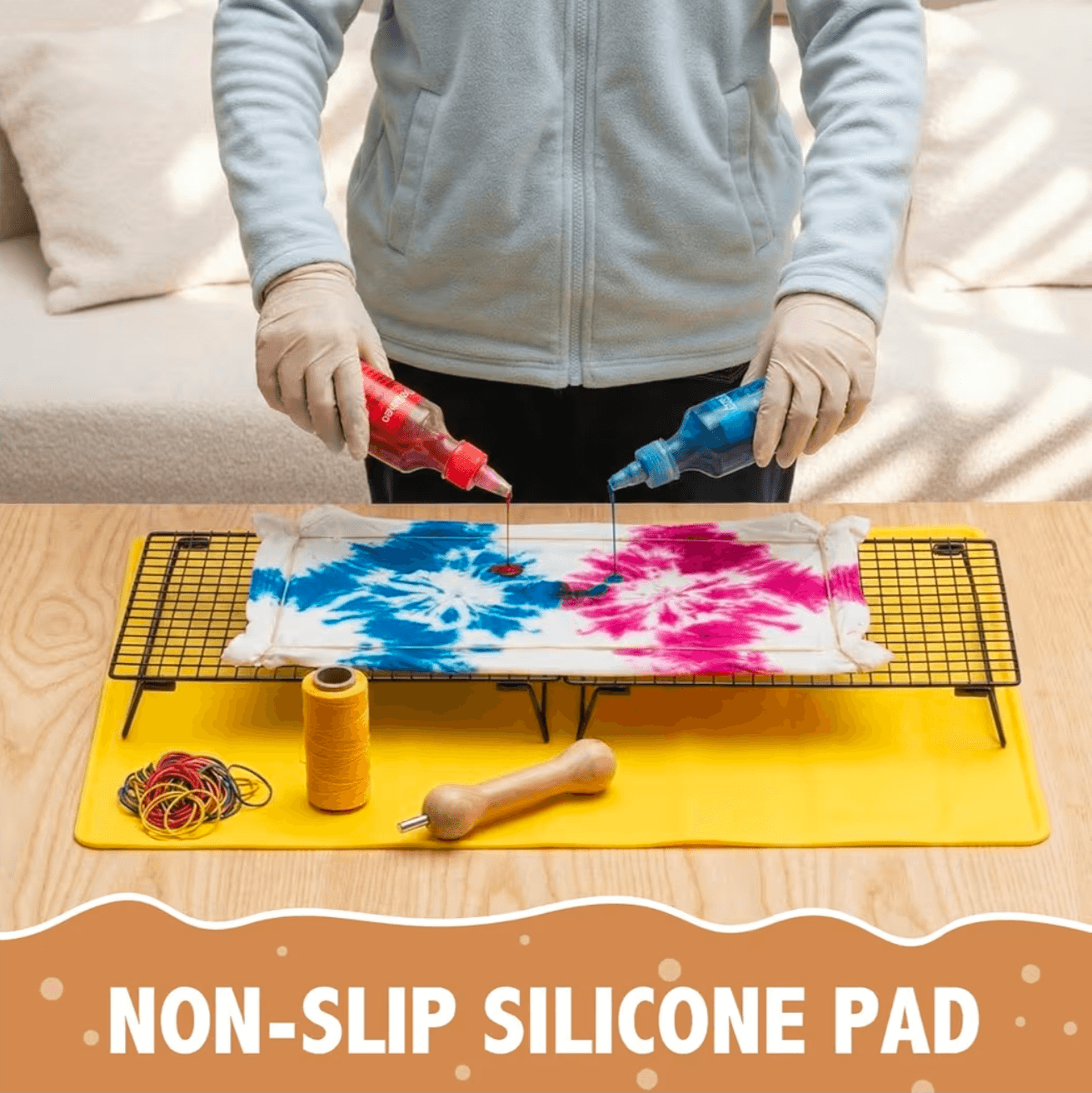 Tie-dye kit with non-slip silicone pad for DIY Tie Dying Projects, featuring tie-dye supplies and gloves.